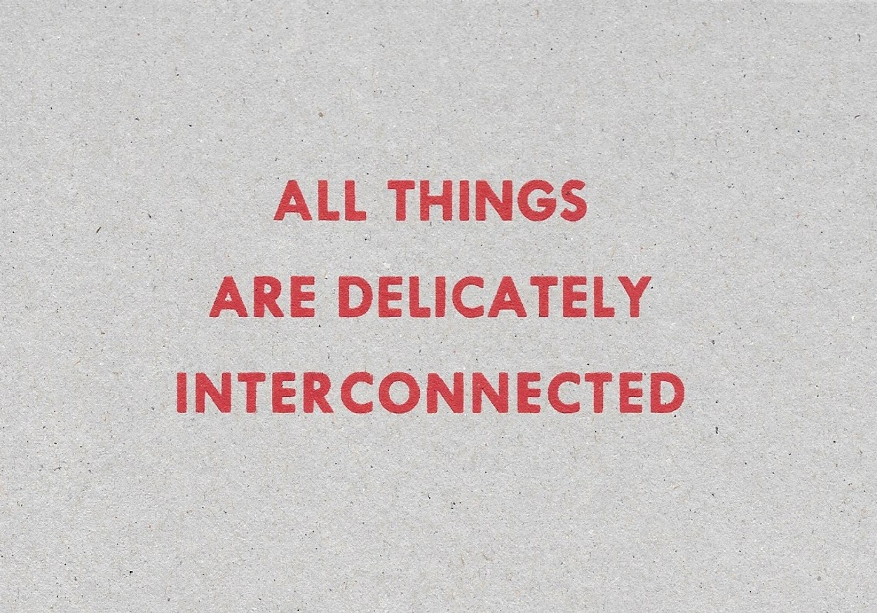 All Things are Delicately Interconnected [Red Text on Cardboard]